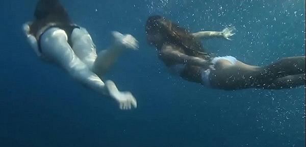  Naked girls on Tenerife having fun in the water